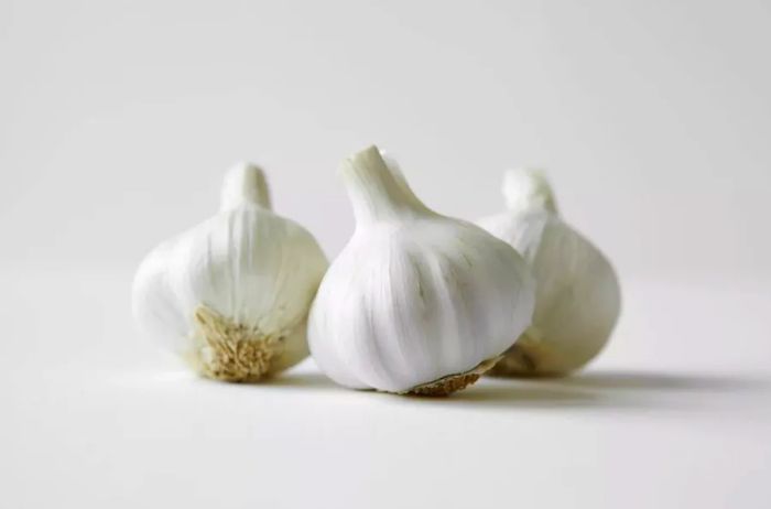 three garlic bulbs