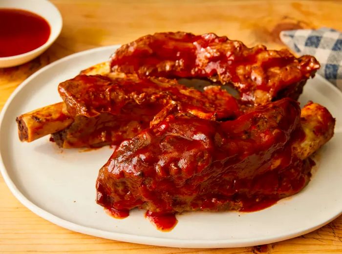 Close-up of a plate filled with slow-cooked BBQ beef ribs