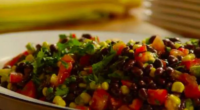 This vibrant salad comes together in just 25 minutes and is bursting with flavor. Each bite features zesty lime juice, fresh tomatoes, sweet corn, black beans, green onions, cilantro, and creamy avocado—ingredients you likely already have in your kitchen. Want to make it heartier? Add some romaine lettuce and a sprinkle of cotija cheese to round it out.