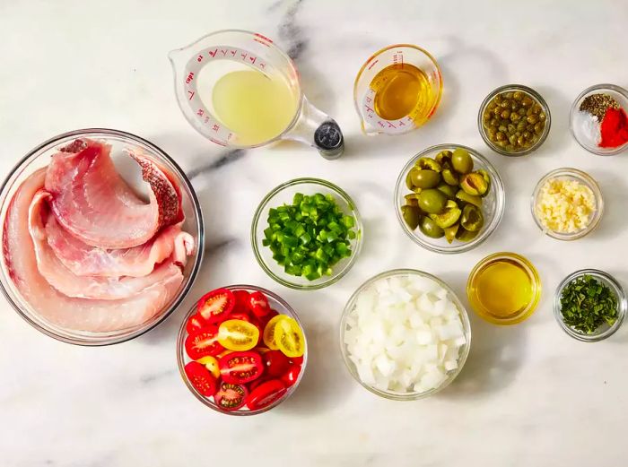 Veracruz-Style Red Snapper ingredients displayed in glass bowls