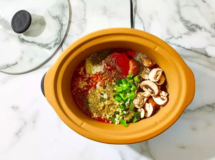 The remaining ingredients are added to the slow cooker.