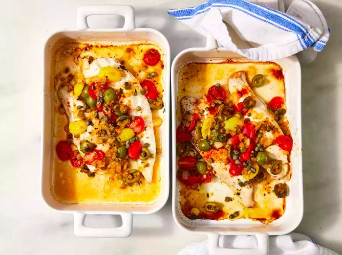 Baked Veracruz-Style Red Snapper in a white baking dish.