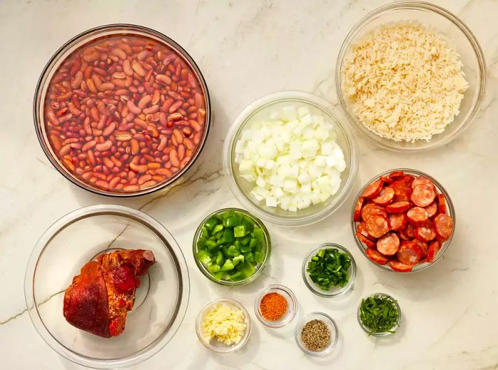 Ingredients for Louisiana Red Beans and Rice in glass bowls