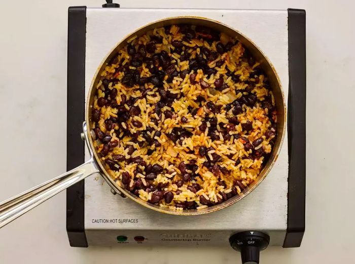 A pot of flavorful black beans and rice