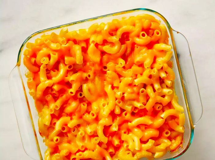 A top-down view of the golden-brown baked macaroni and cheese in a baking dish.