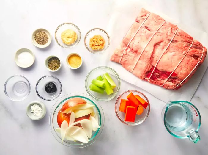 A selection of bowls filled with ingredients for preparing the Christmas prime rib.