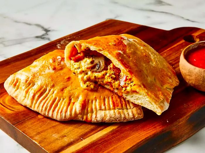 A close-up of an Italian calzone, cut in half