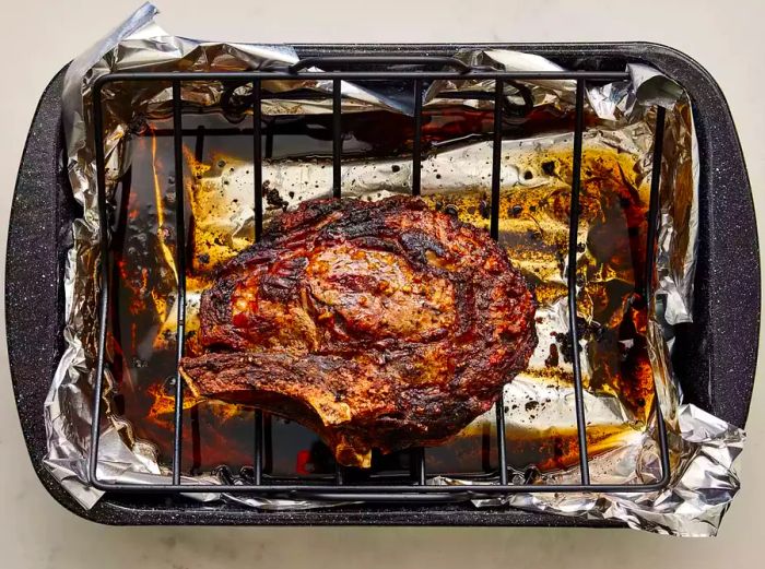 The perfectly roasted Easy Rib Eye rests beautifully in the roasting pan.