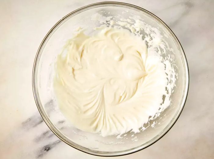 A bowl of egg whites whipped and mixed with mochiko flour