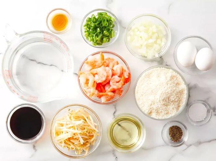 All ingredients are ready for preparing shrimp fried rice.