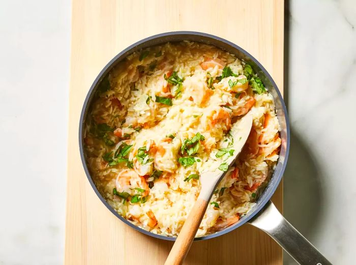 Parmesan cheese and fresh basil stirred into the skillet.