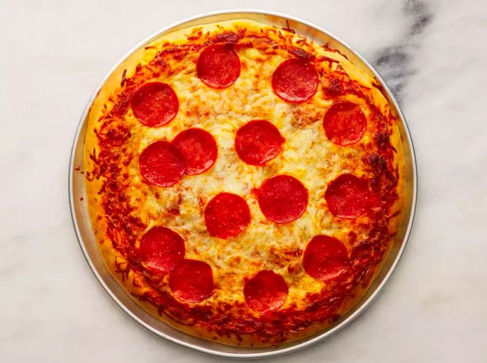 A bird's-eye view of a perfectly cooked pepperoni pizza.