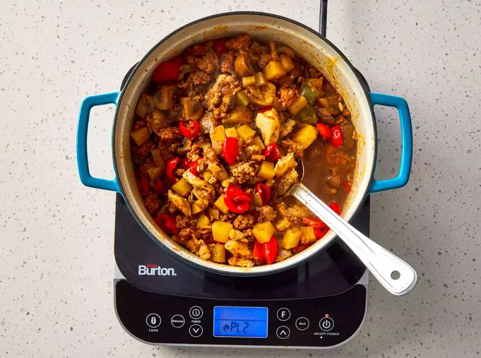 Chicken, sausage, and Peppadew peppers mixed into the potato mixture.