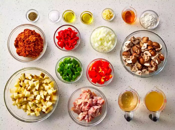 All the ingredients for Chicken Murphy neatly arranged in bowls on the kitchen counter.