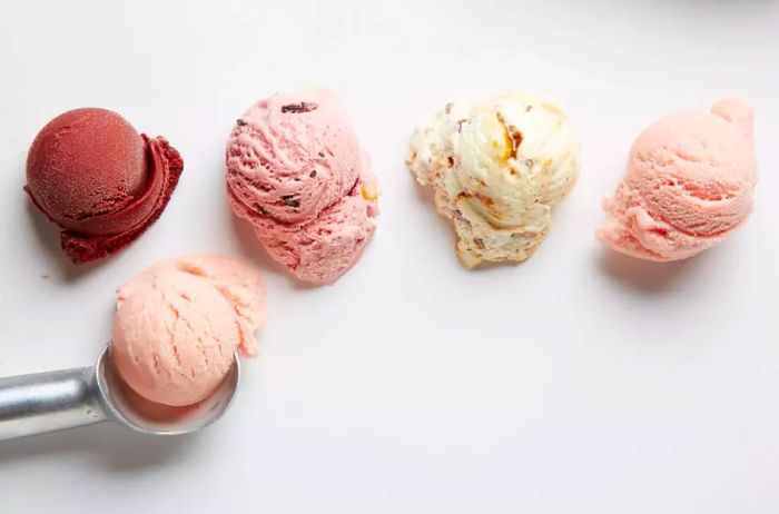 Scoops of chocolate, cherry, pecan, and peach-flavored ice cream