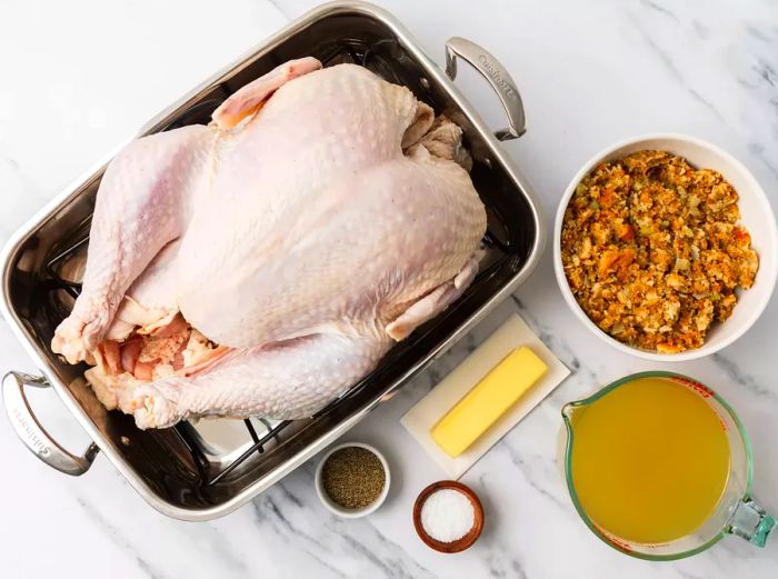 Essential ingredients for preparing roasted turkey.