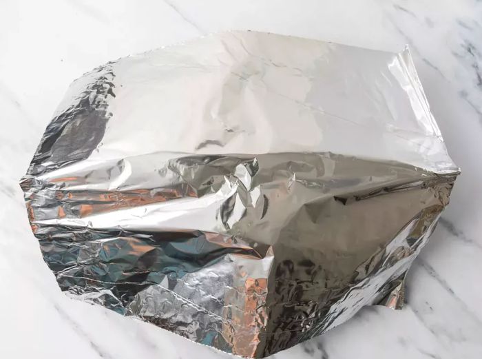 Turkey covered with foil.