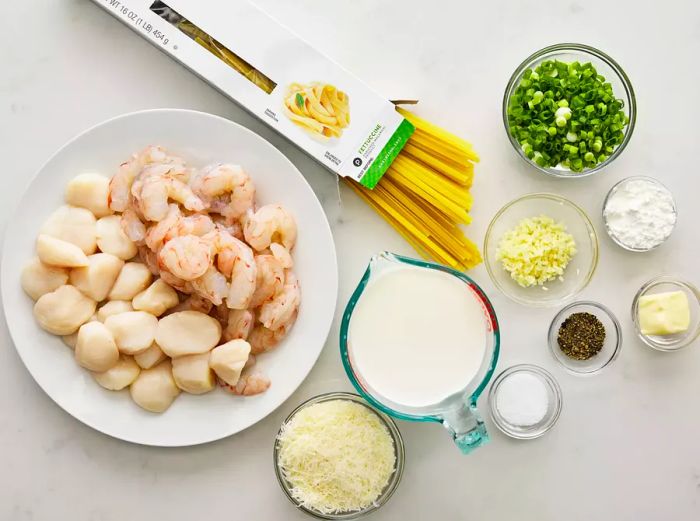 All ingredients are ready to prepare the seafood fettuccine.