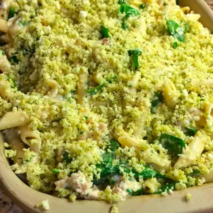 Close-up of Pesto Chicken Penne Casserole in a baking dish