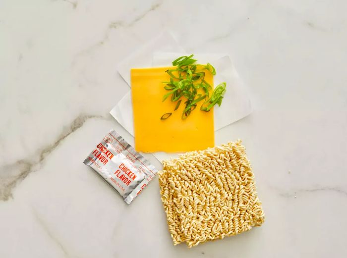 Top-down view of measured ingredients ready for cheesy ramen