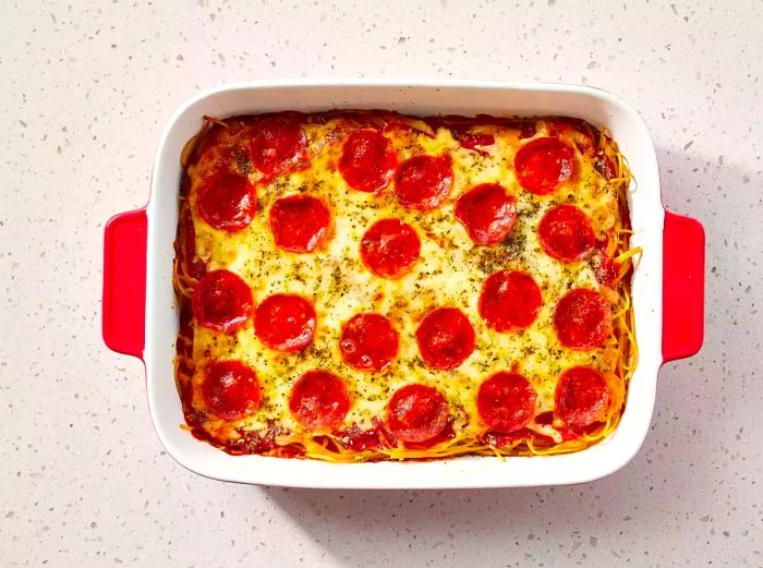 Spaghetti Pizza served in a casserole dish