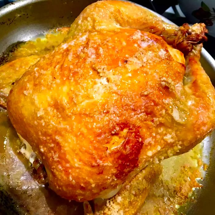 Close-up shot of Salt-Crusted Chicken in a roasting pan