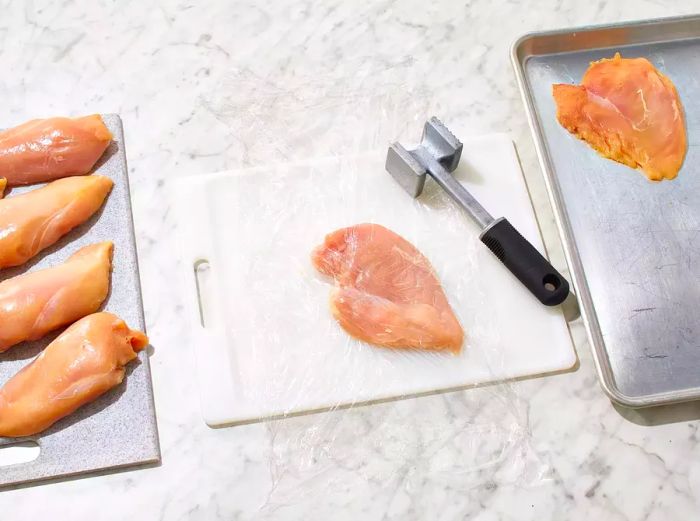 Chicken breast halves tenderized with a meat mallet to about 1/8-inch thickness.