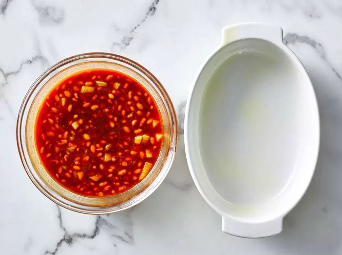 Baked beans in a bowl, ready to be transferred to the baking dish.