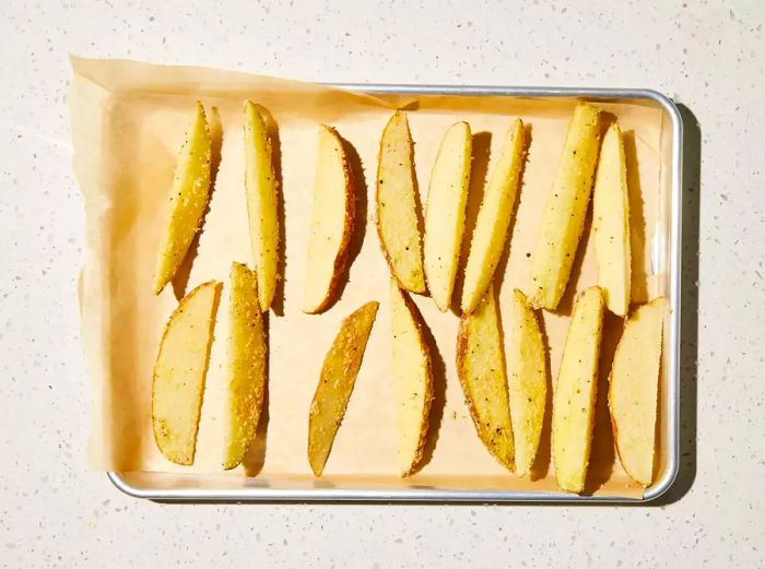 potatoes arranged on a baking sheet