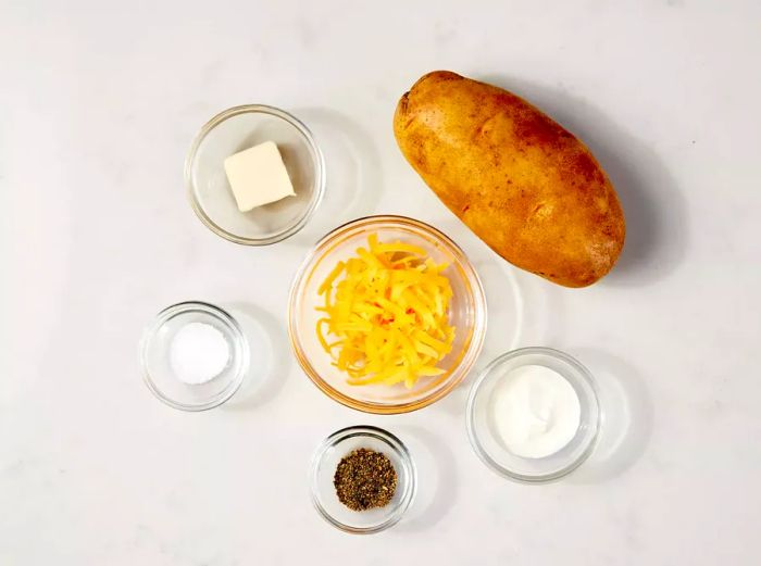 Ingredients needed for a microwave baked potato.