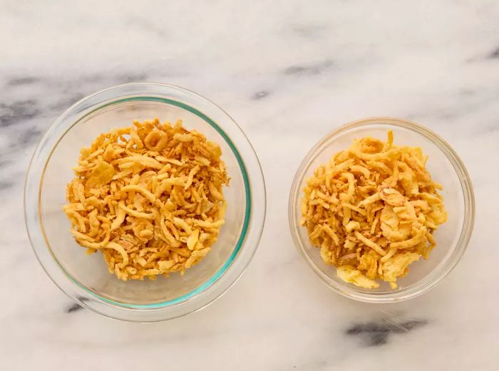 Two small bowls filled with crispy fried onions