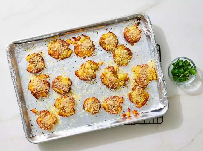 Crispy, golden smashed potatoes with a crunchy texture.