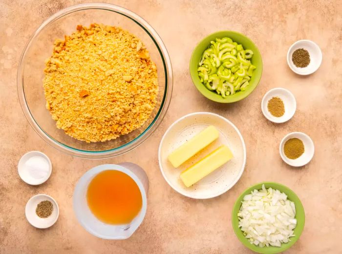 A bird's-eye view of the stuffing ingredients arranged in bowls and dishes.