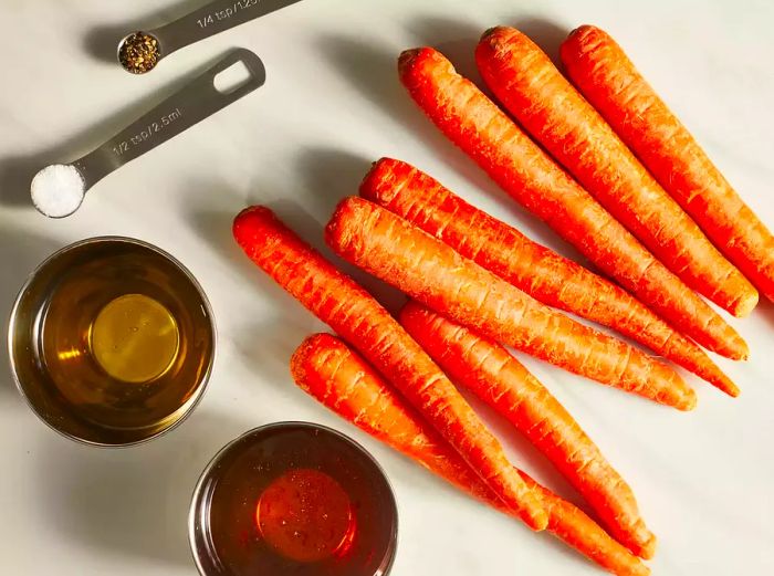 All ingredients prepared for making honey roasted carrots.