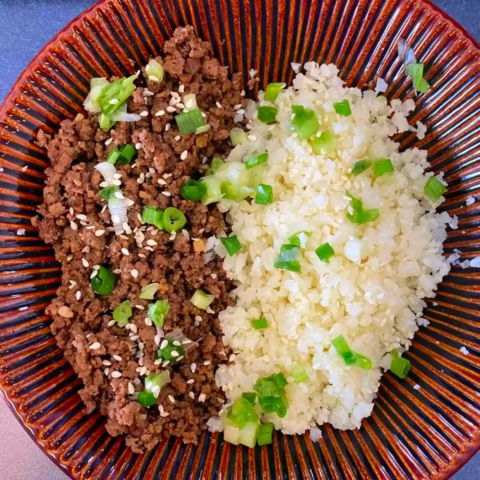 Easy Keto Korean Beef with Cauli Rice served in a brown bowl