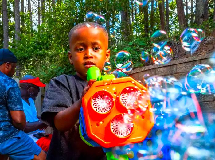 Dakari Akorede’s son, Dylan, enjoying his bubble machine in their backyard.