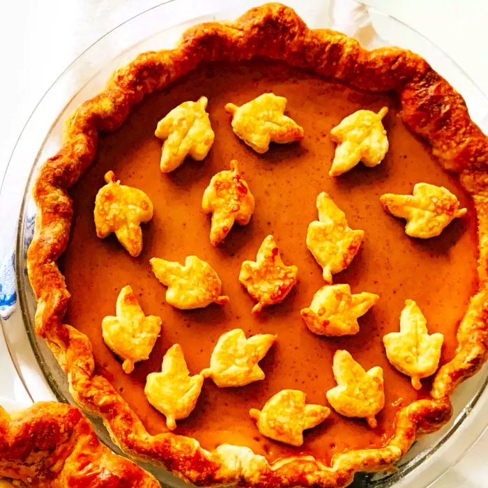 pumpkin pie with delicate pastry leaf cutouts on top