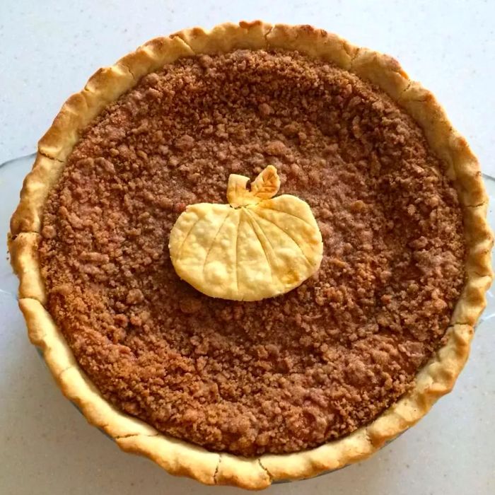 The Brown Family's Pumpkin Pie with a decorative pumpkin-shaped crust.