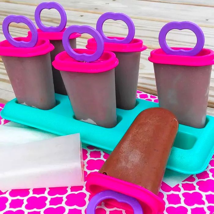 Homemade frozen pudding pops in plastic molds