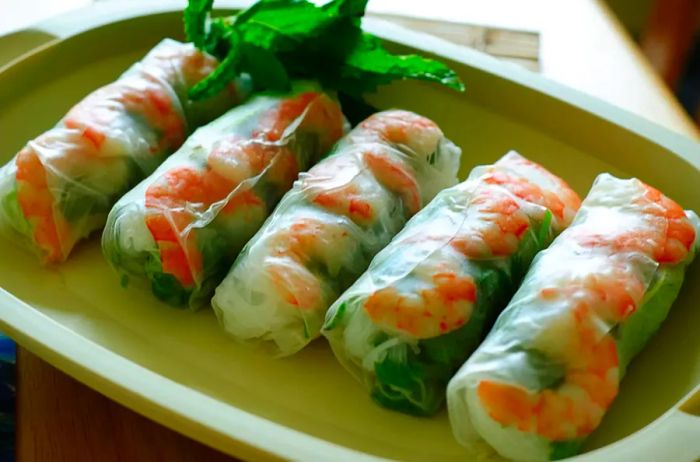 Vietnamese Fresh Spring Rolls on a vibrant green plate