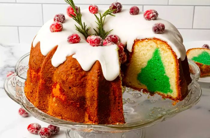 side view of a Christmas Tree Surprise Cake with the tree shape revealed in the sliced layers