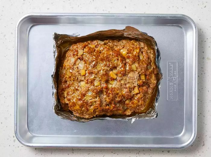 Broil the meatloaf until the top is browned and crispy.