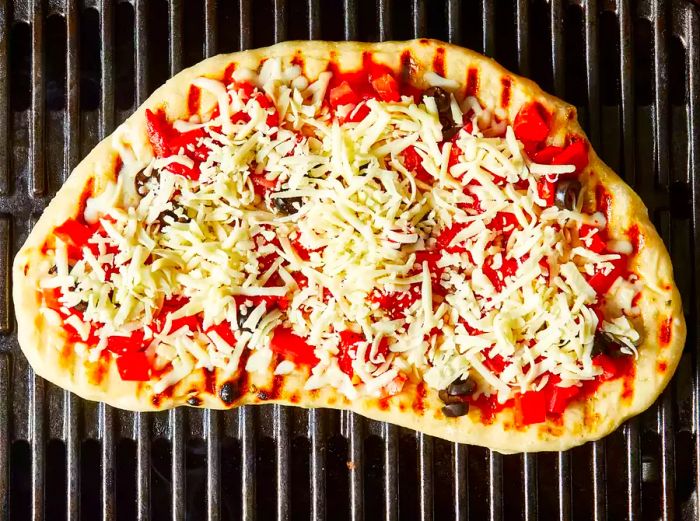 Spread all the toppings evenly over the crust.