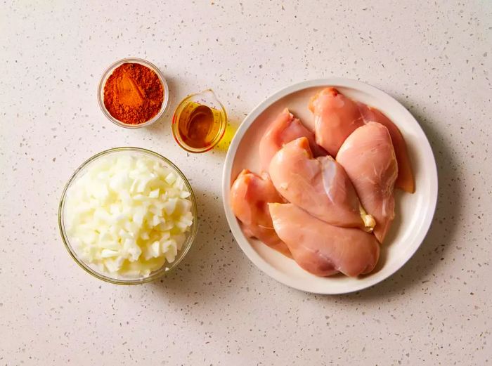 Ingredients for Easy Chicken Curry on a white countertop