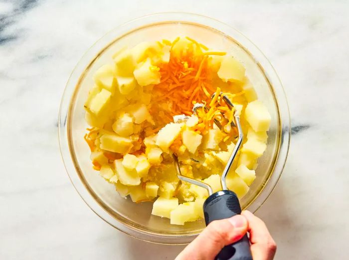 potatoes, cheese, and seasonings mashed into a creamy mixture