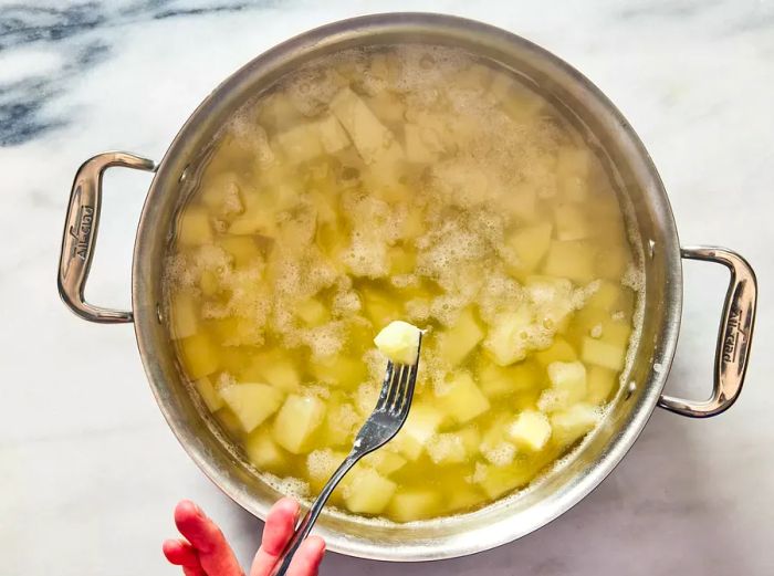 potatoes cooked until soft and easily pierced with a fork