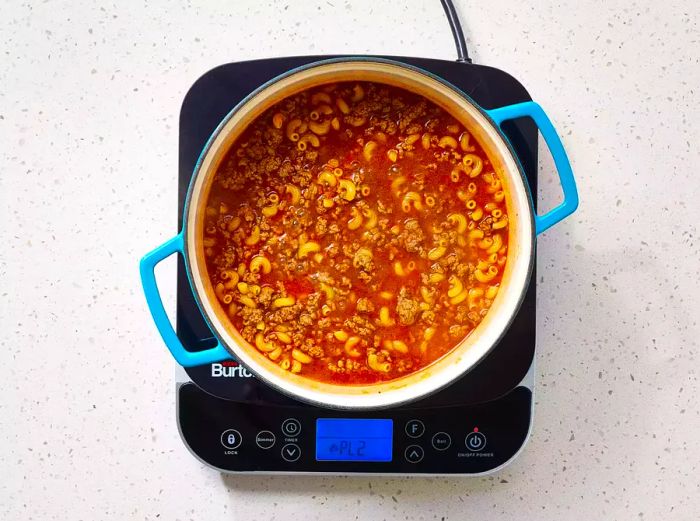 beef broth and macaroni added to the ground beef mixture