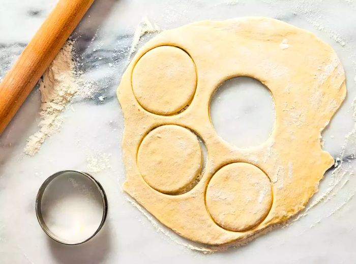 dough rolled out and circles being cut from the sheet