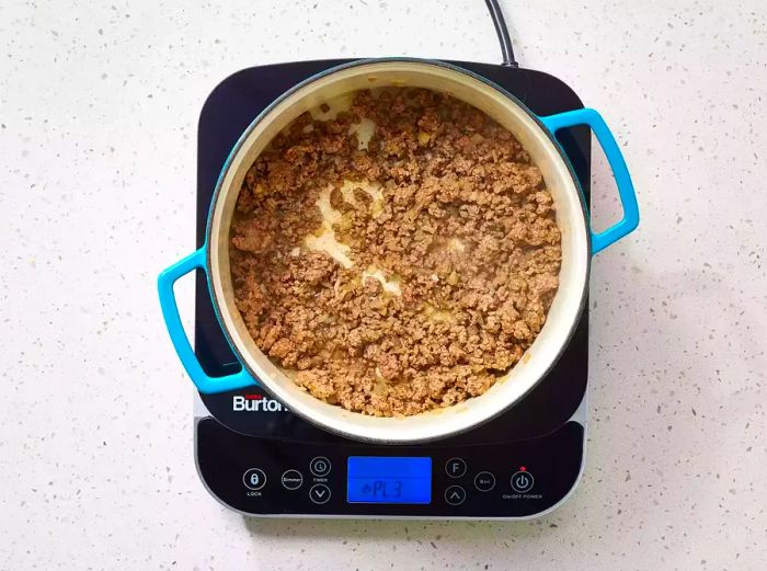 ground beef browning in a skillet