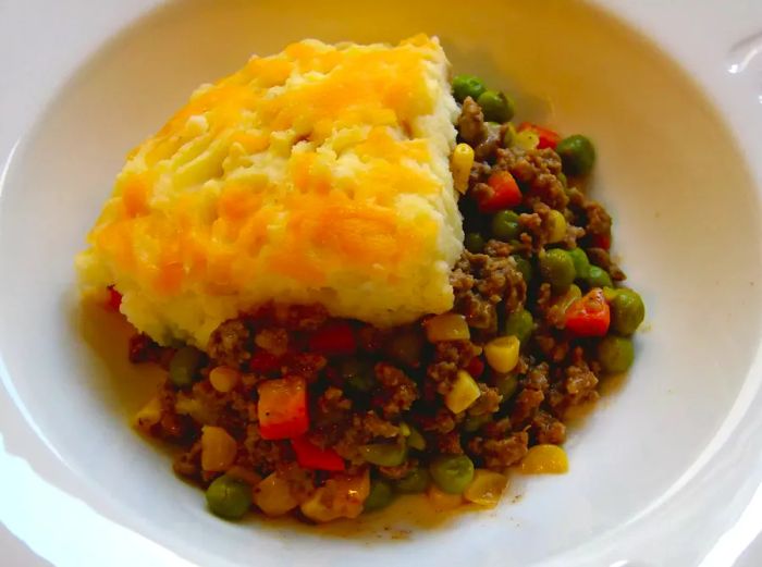 A top-down view of a serving of Chef John's Shepherd's Pie served in a white bowl.